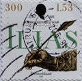 A postage stamp printed in Germany showing a hand with a pen, title: Ã¢â¬ËILIASÃ¢â¬â¢ which Voss translated and pro